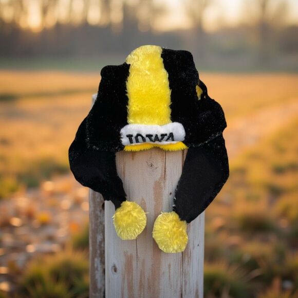 Forever Collectables NCAA Iowa Hawkeyes Dangle Fuzzy Earflap Pom Hat - Picture 1 of 6
